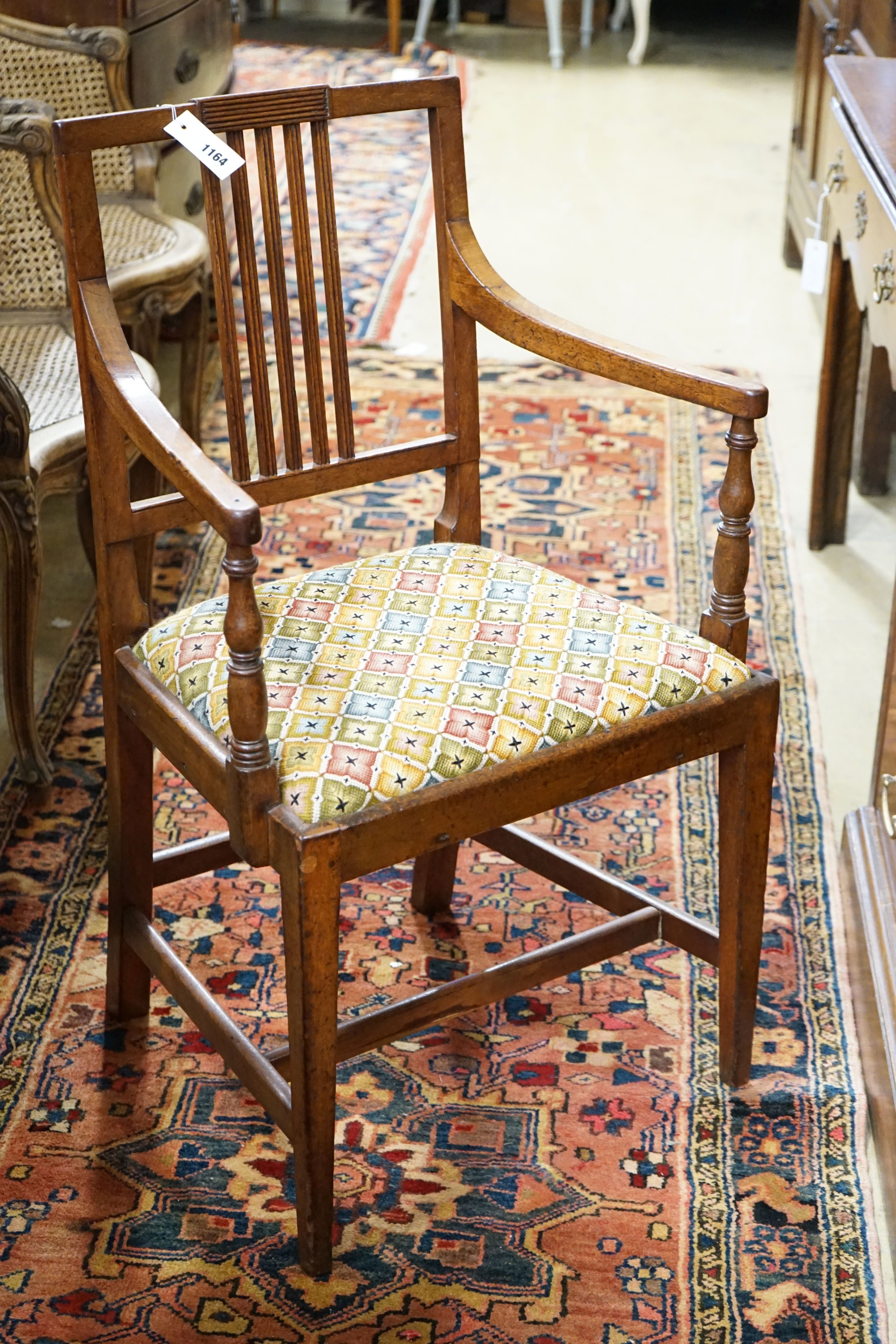 A Regency mahogany elbow chair and three others